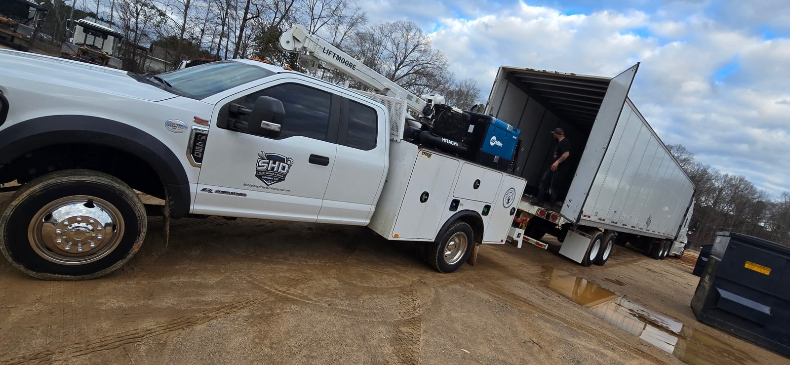 SHD mobile diesel service truck working a fleet trailer